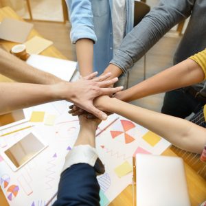 Hands of group of businesspersons showing teamwork